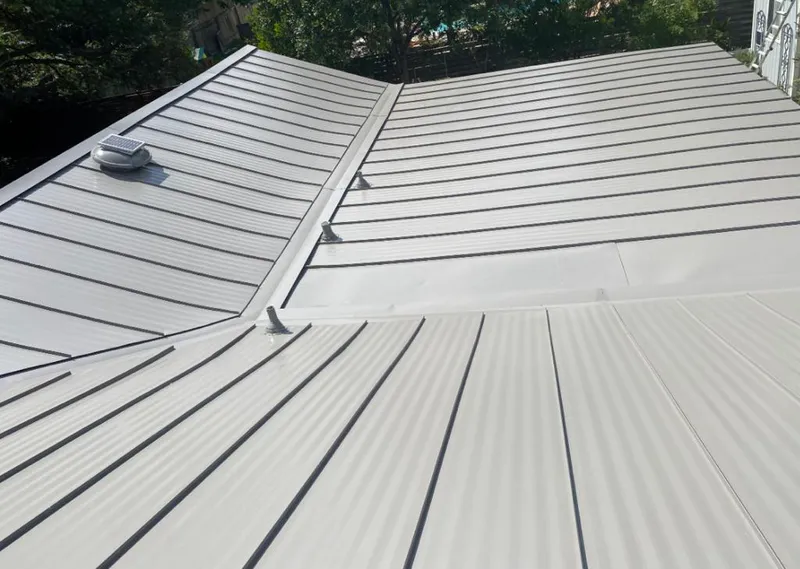 Solar attic fan installed on a metal roof for Roof Ventilation in Bayonet Point